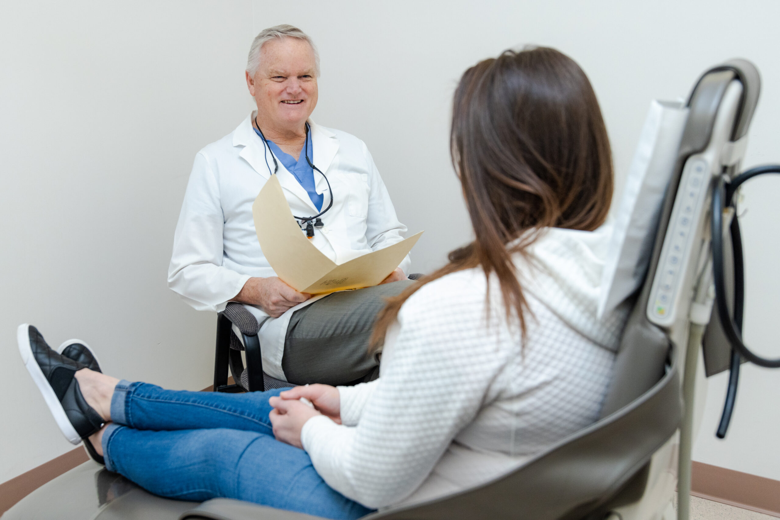 Dr. Craig Little, an oral surgeon in Summerville, SC, meeting with a patient for oral surgery