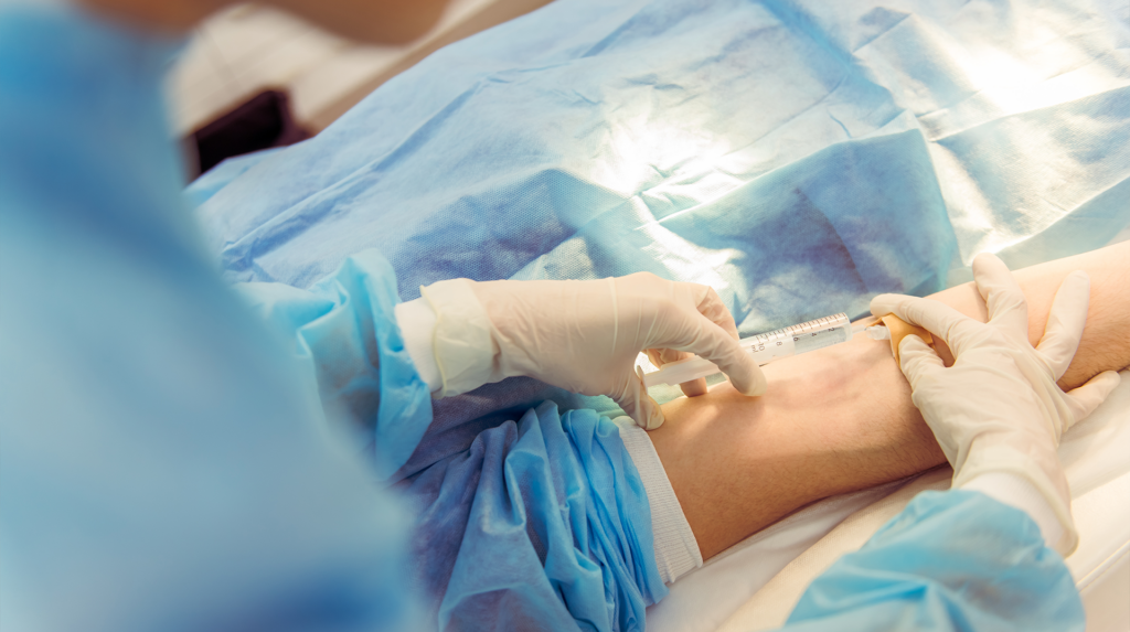 a patient getting anesthesia for their oral surgery procedure